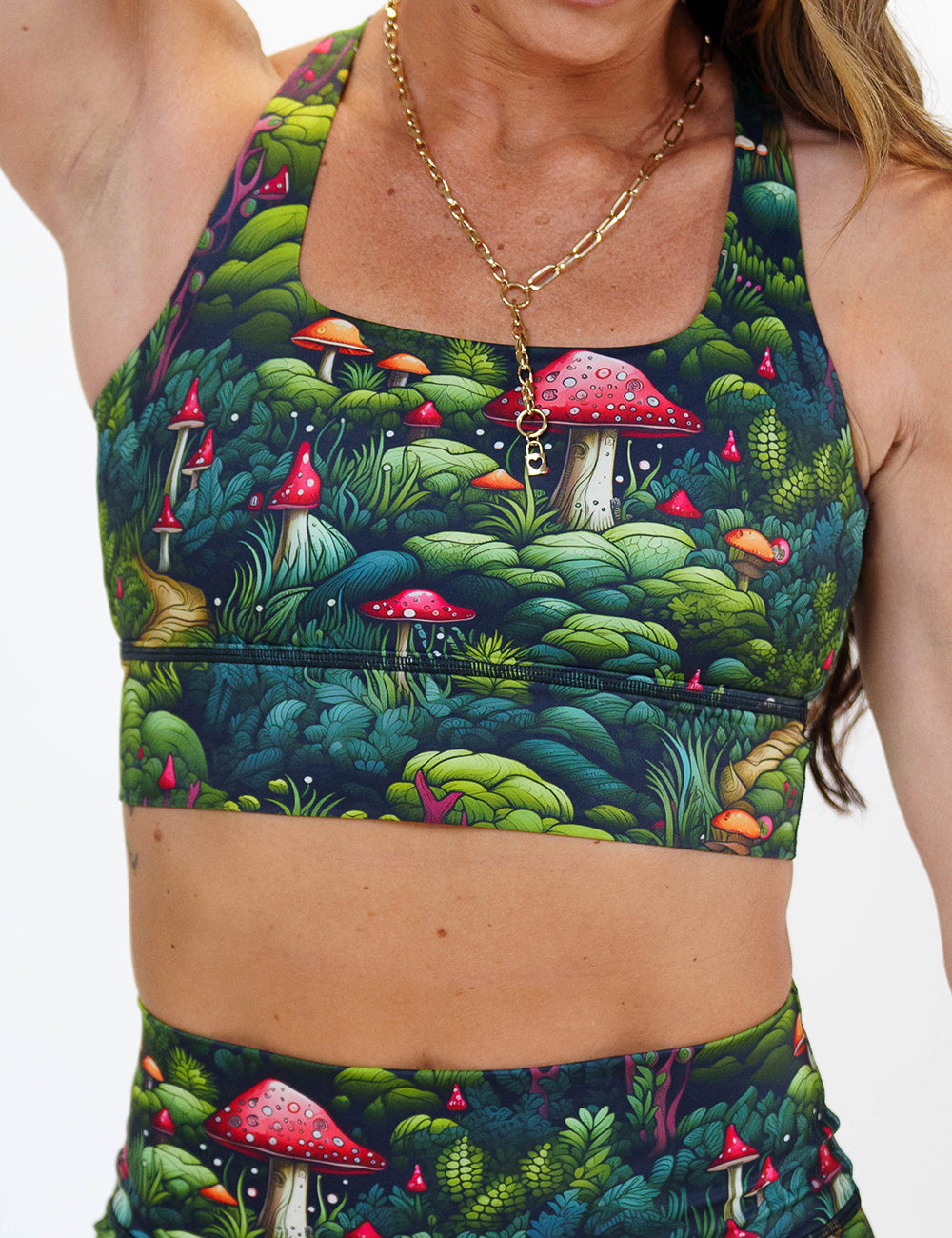 front of the enchanted forest themed sports bra against a white background