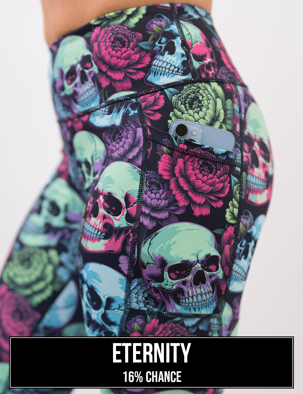 side view of the blue, red, and green with flowers leggings with a phone in its pocket, the name of this print is eternity and it has a 16% chance of being unboxed