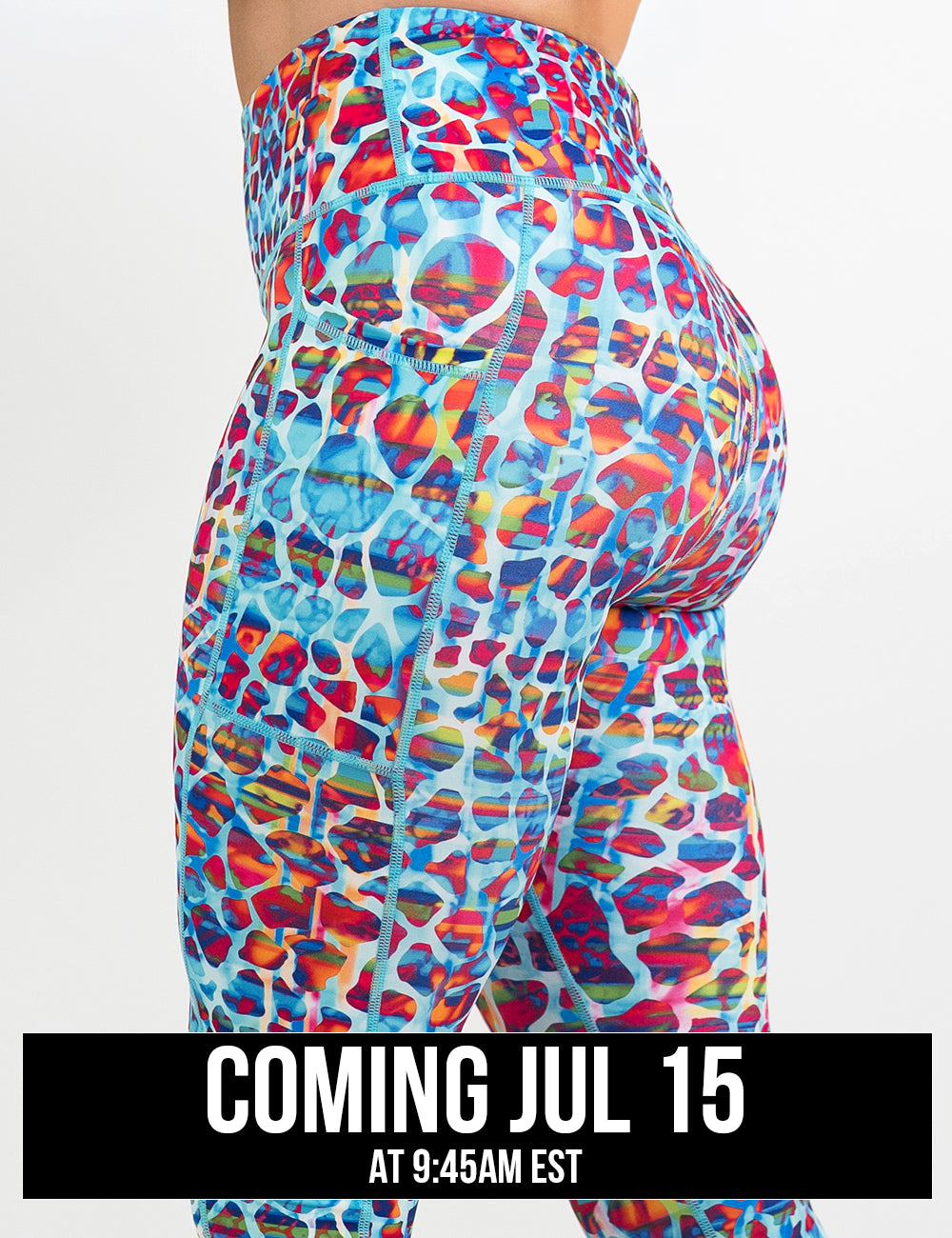side view of the turquoise, coral, pink, orange, purple, and yellow mosaic style pattern leggings against a white background, coming july 15th