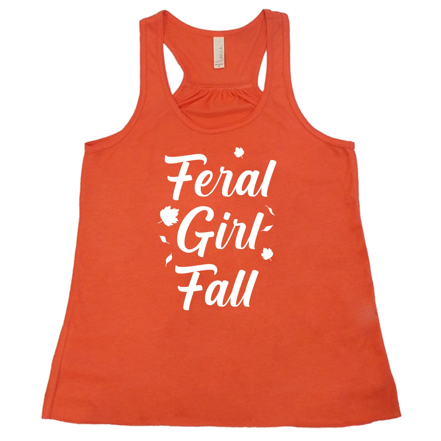 white quote "Feral Girl Fall" on a coral racerback shirt