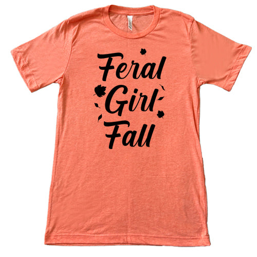 black quote "Feral Girl Fall" on a coral shirt