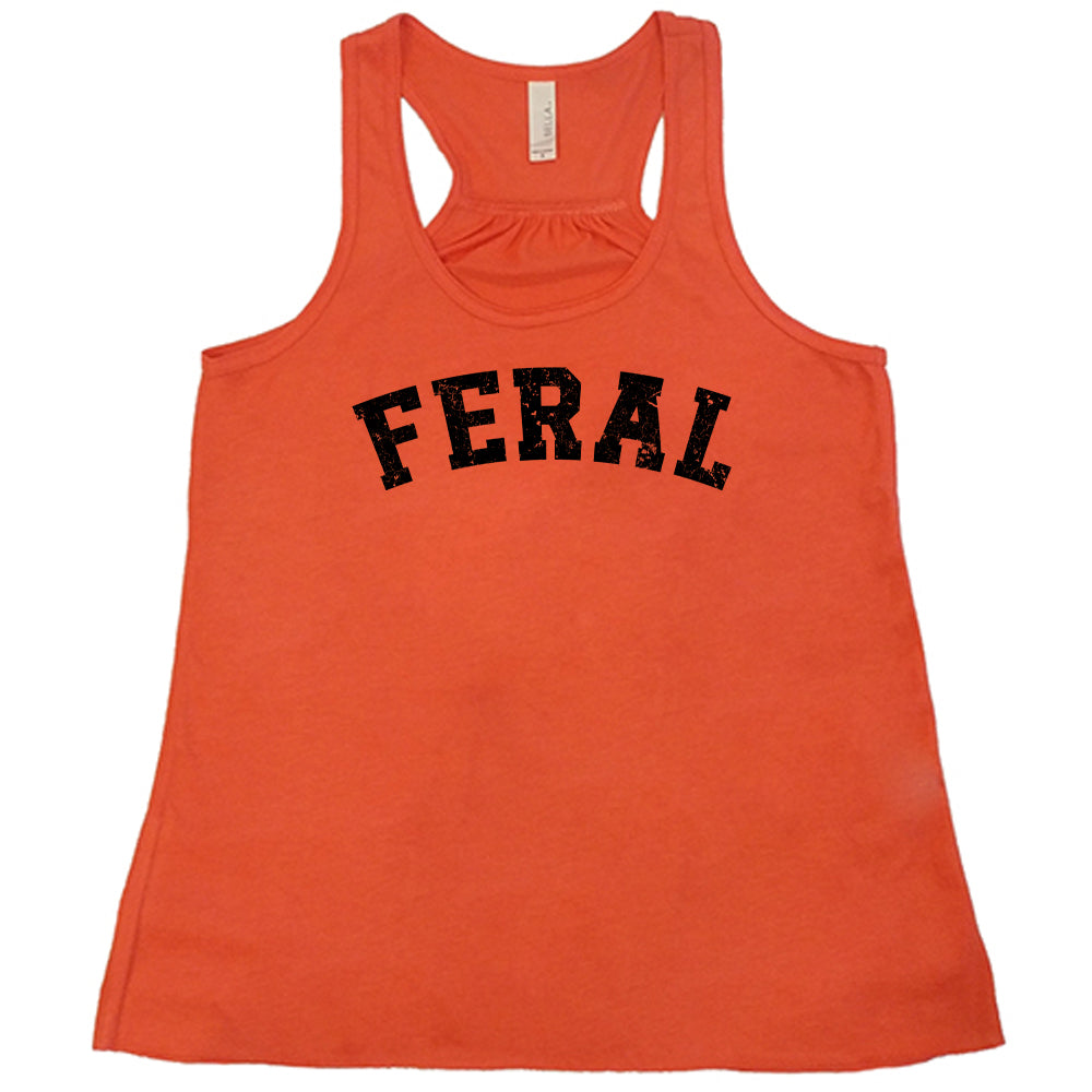 coral shirt with the word "feral" in the middle of it