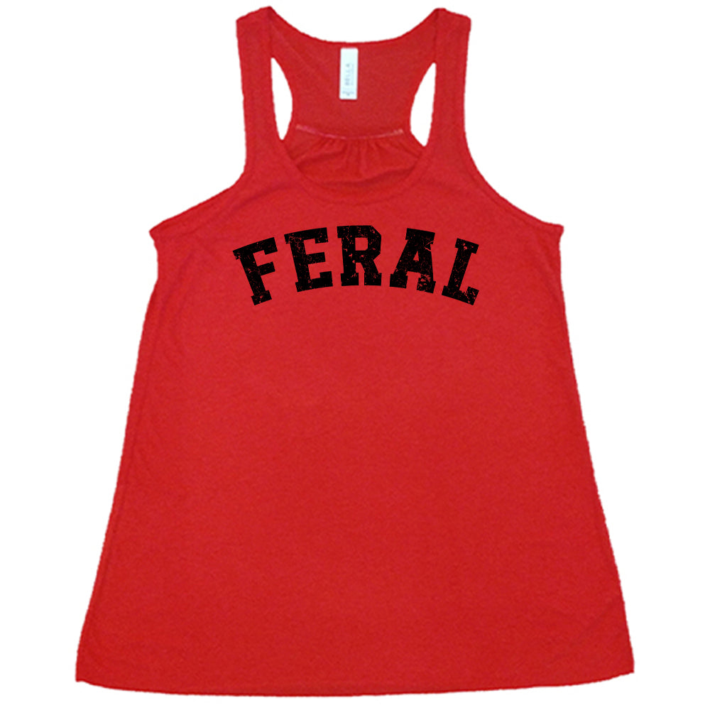 red shirt with the word "feral" in the middle of it