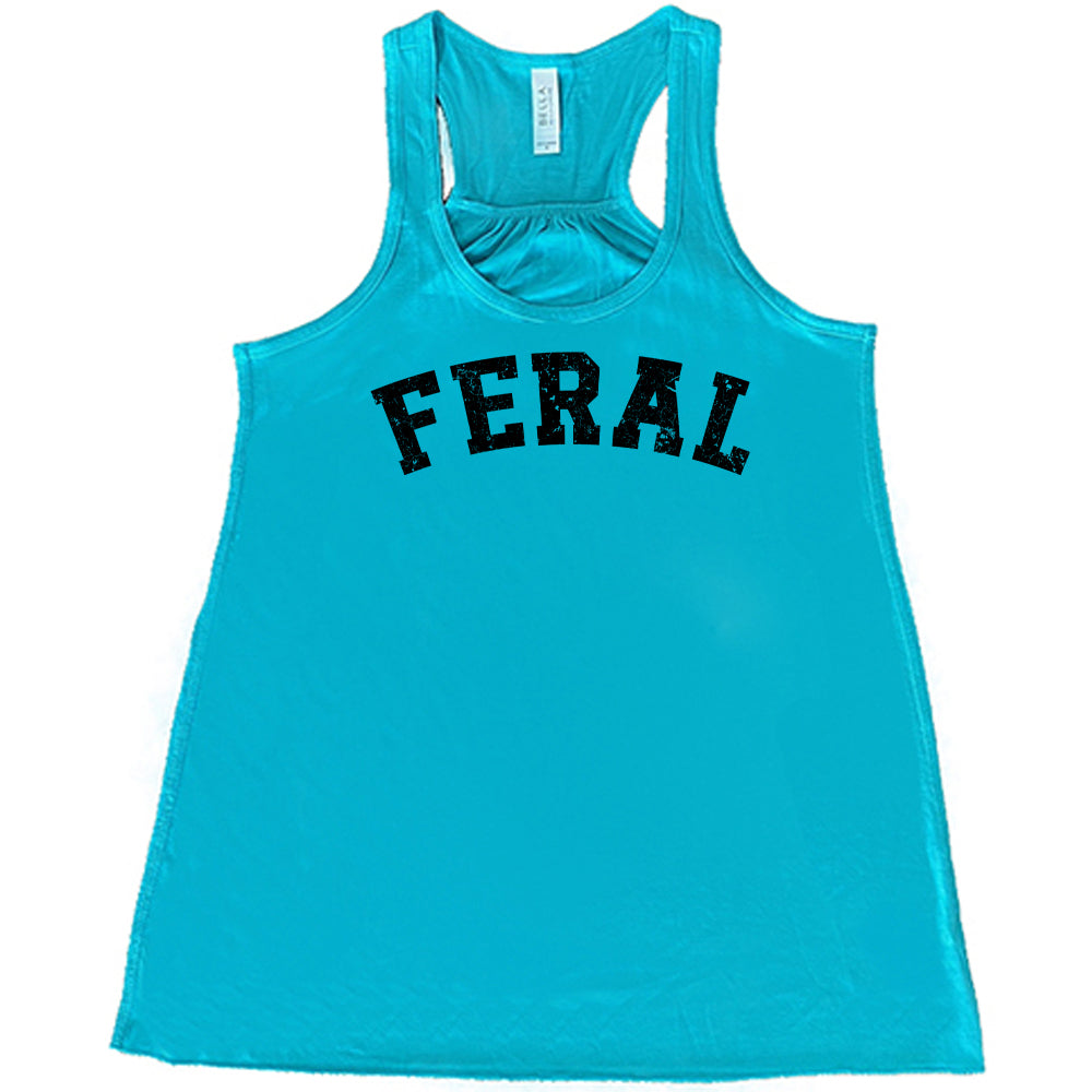 teal shirt with the word "feral" in the middle of it