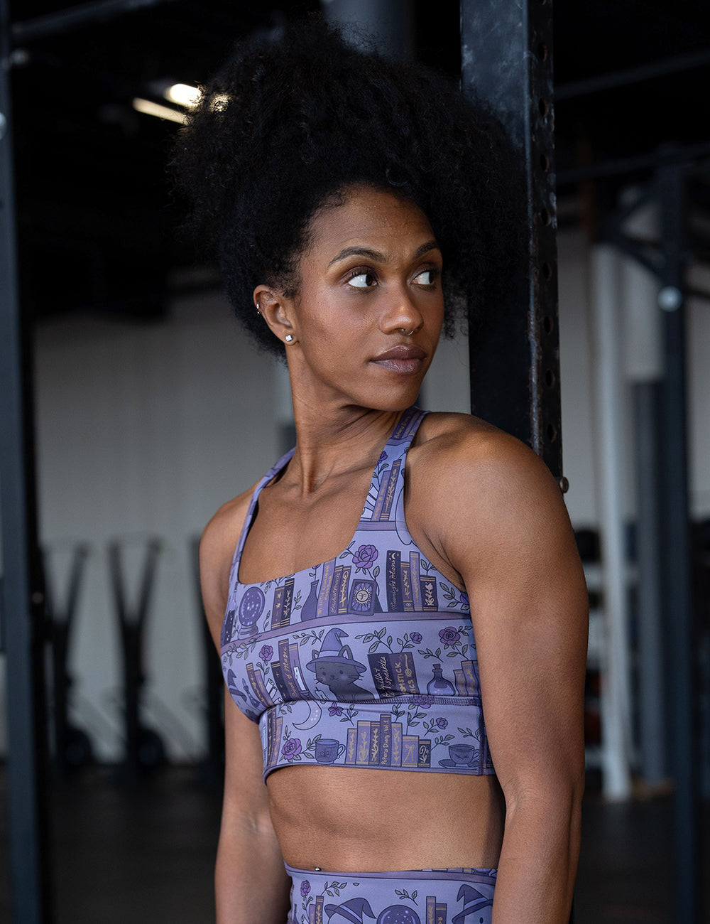 model wearing the ghosts and cats book shelves bra in the gym