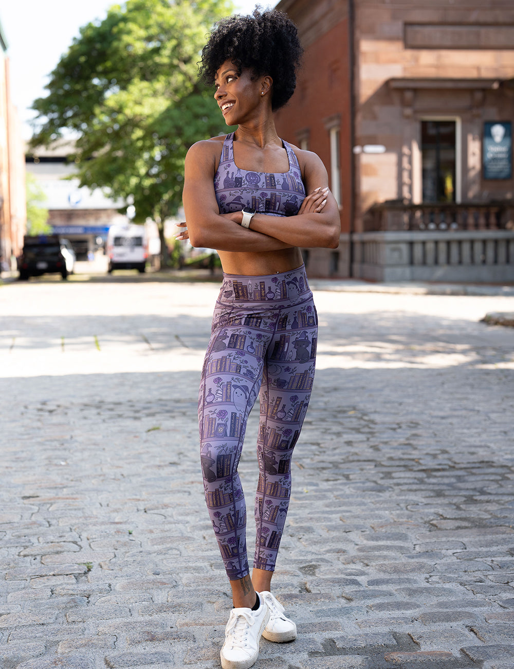 model wearing the full length ghosts and cats book shelves leggings and bra