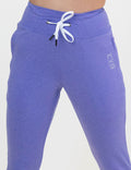 Purple joggers against a white background