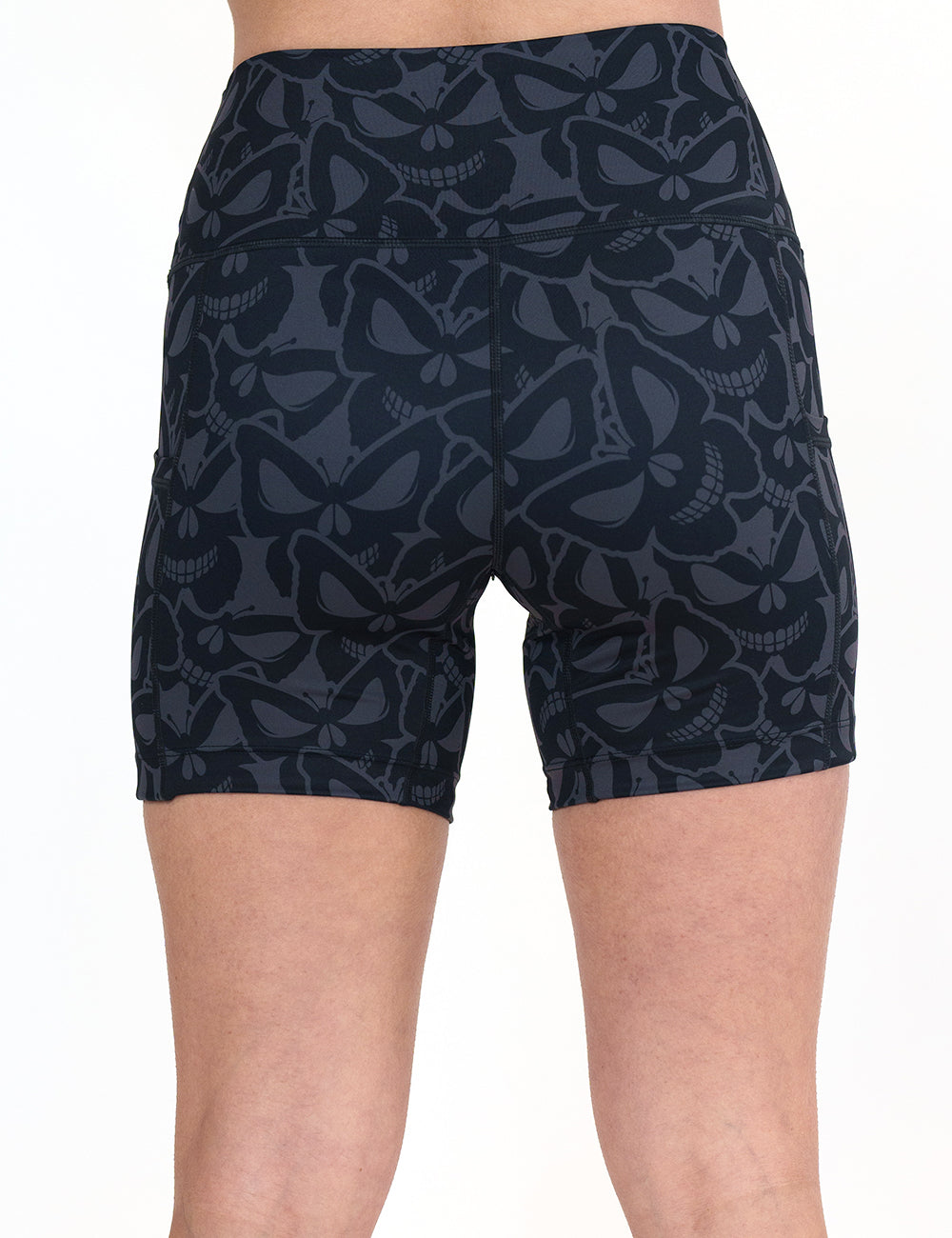 back of the 5 inch grey and black butterfly shaped skulls patterned shorts against a white background