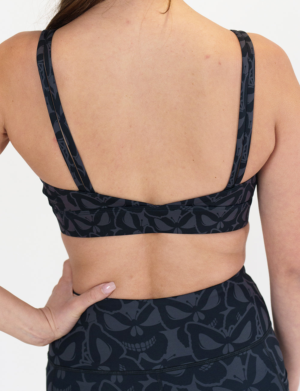 back of the grey and black butterfly shaped skulls patterned bra
