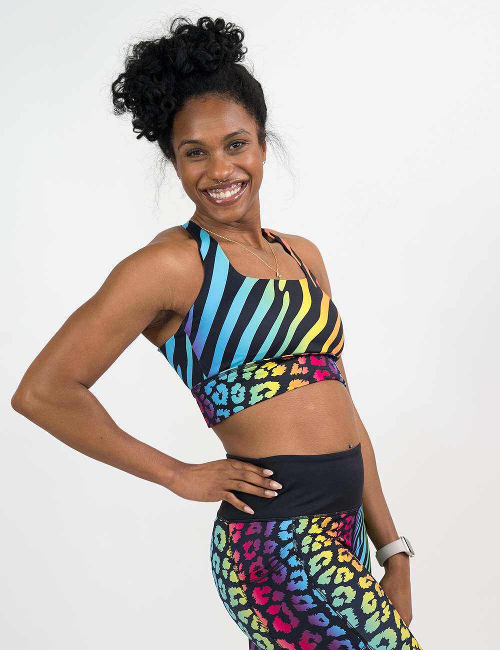 model wearing the rainbow leopard and zebra print longline bra against a white background