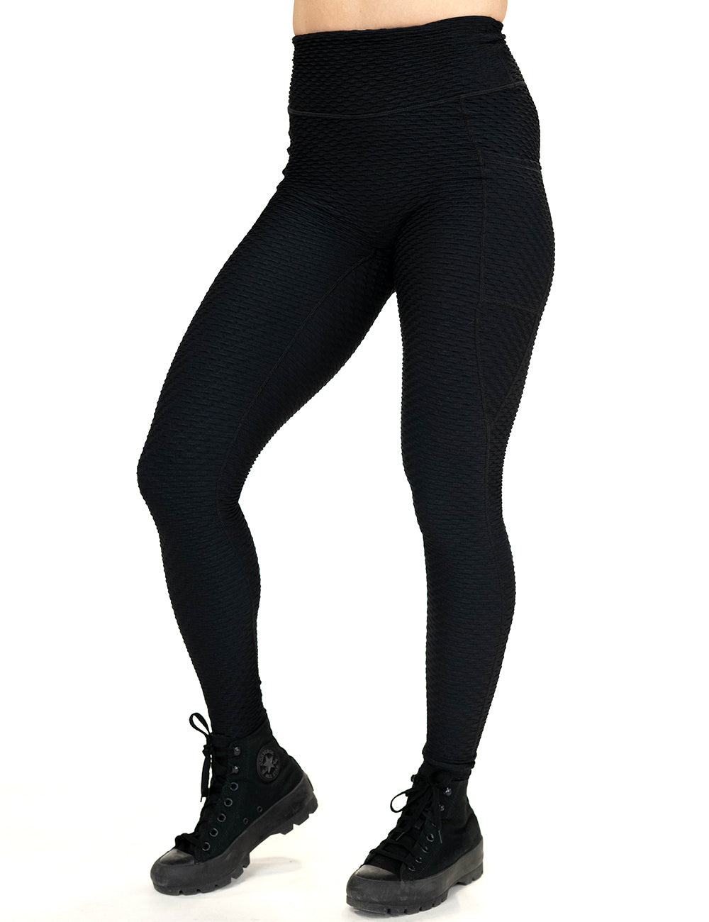 front of the full length black waffled texture leggings against a white background