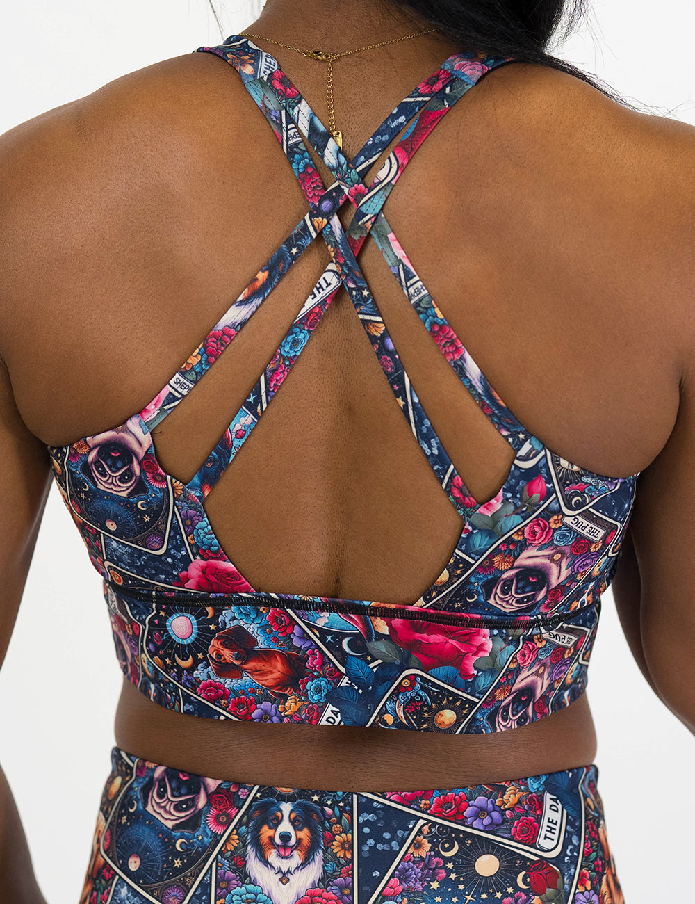 back of the colorful sports bra with dog illustration pattern on it