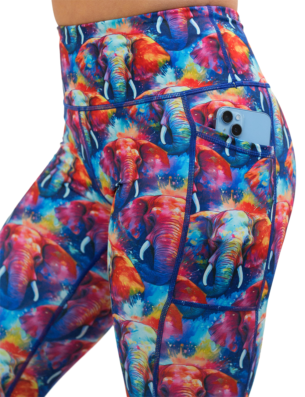 close up of the colorful elephant pattern leggings with a phone in the pocket against a white background
