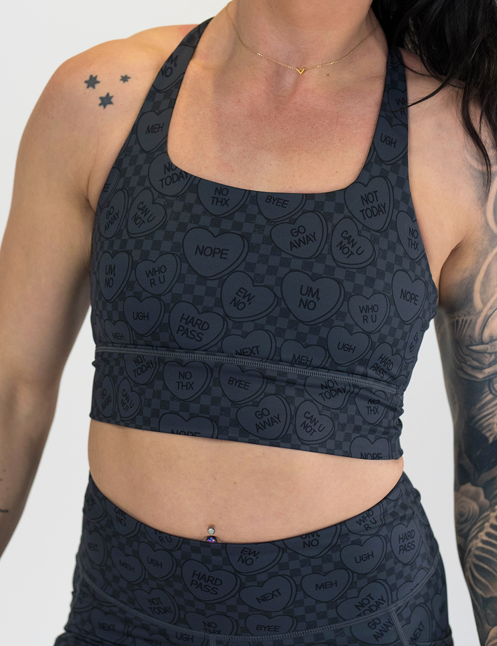 black and grey heart patterned longline sports bra