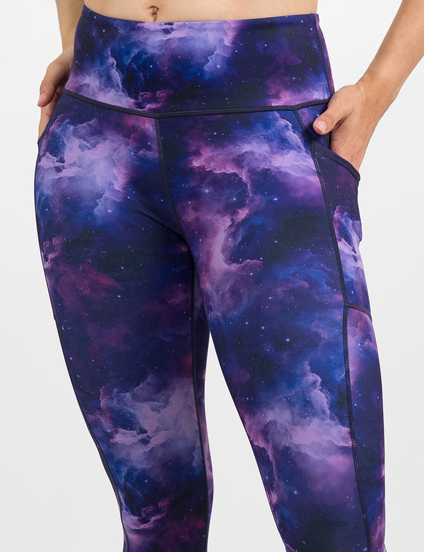 close up of the purple space patterned leggings against a white background