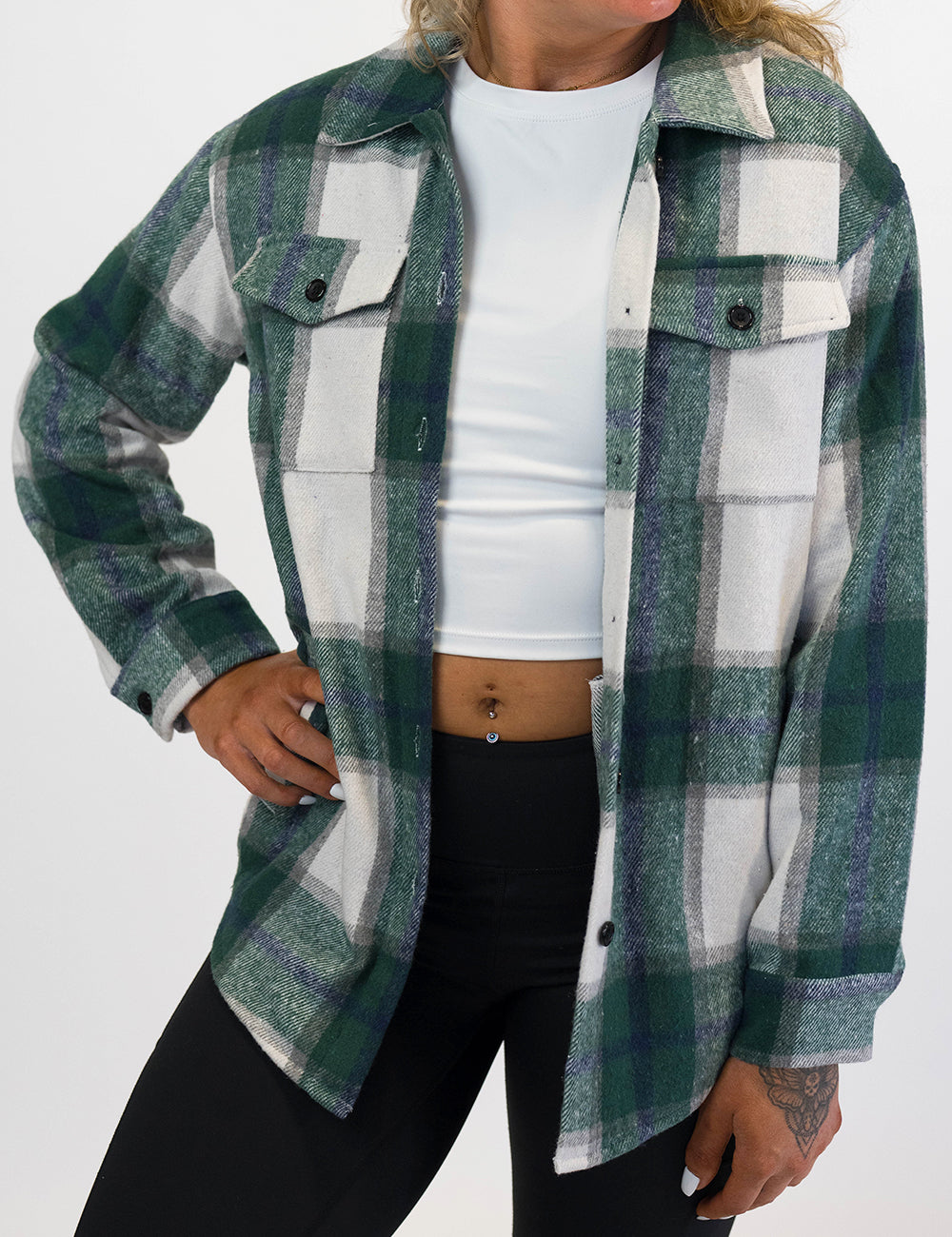 front of the green plaid shacket against a white background