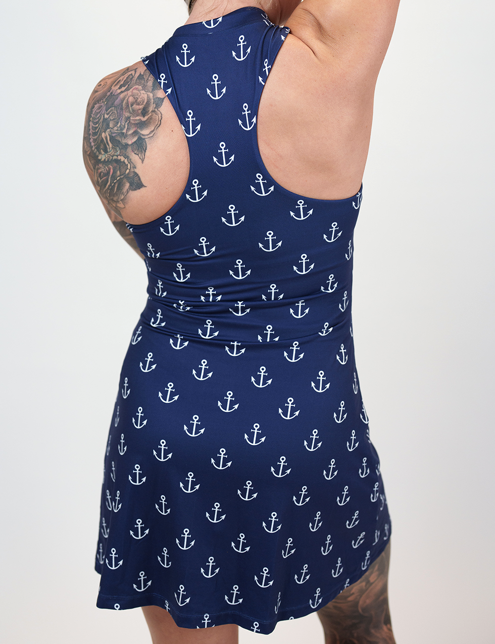 back of the blue dress with white anchors against a white background