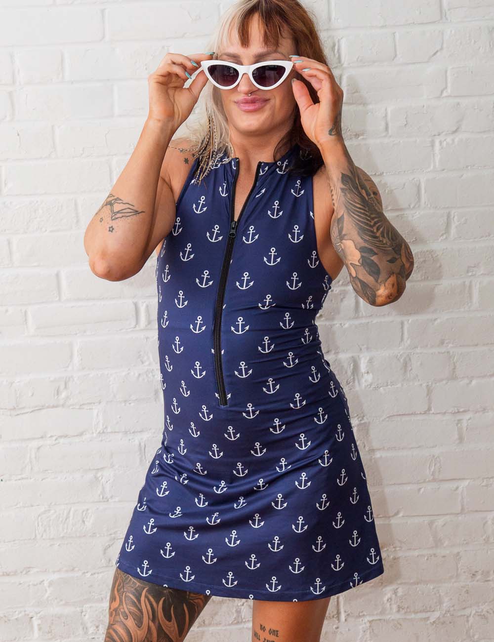 back of the blue dress with white anchors against a white background