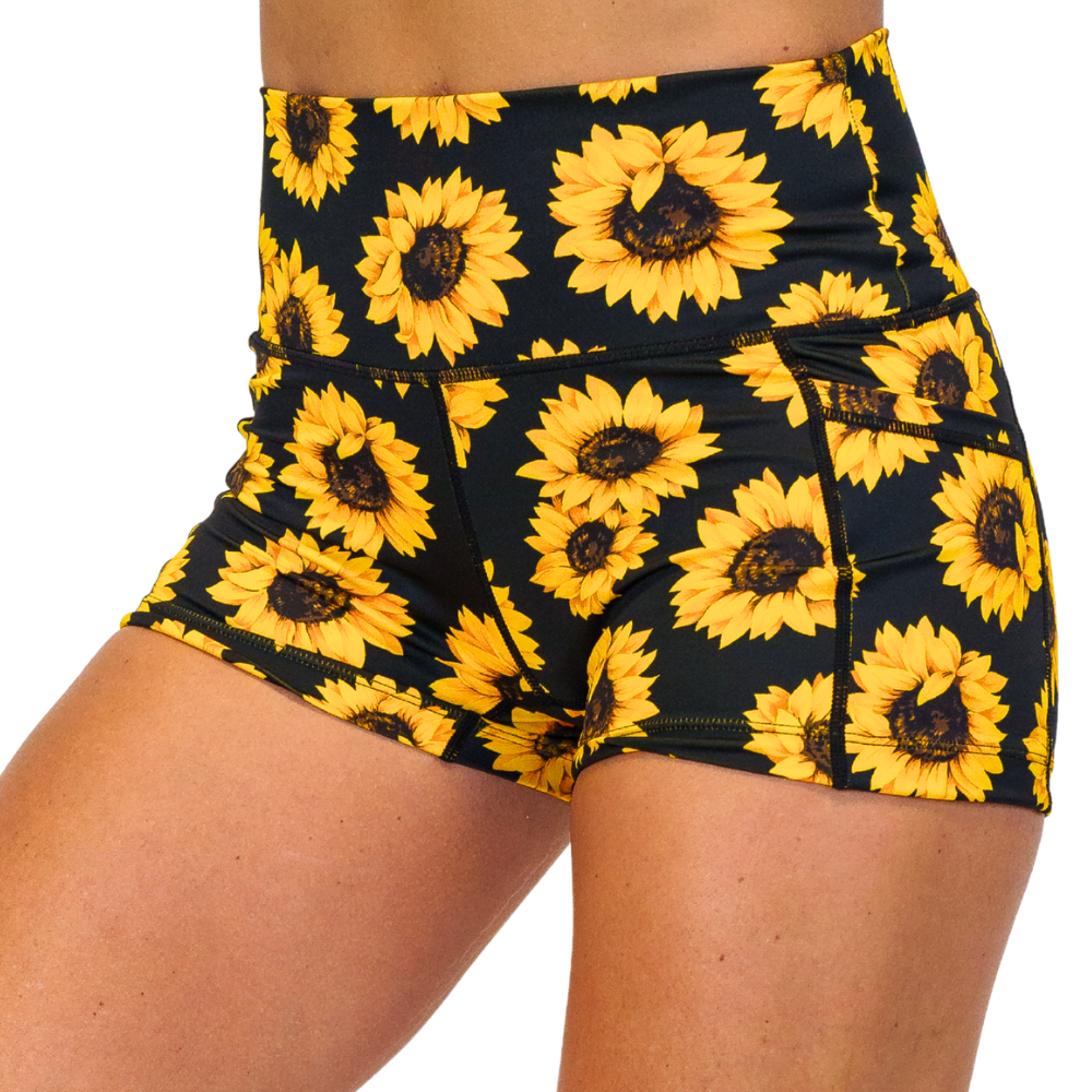 front of the 2.5 inch yellow flower shorts against a white background