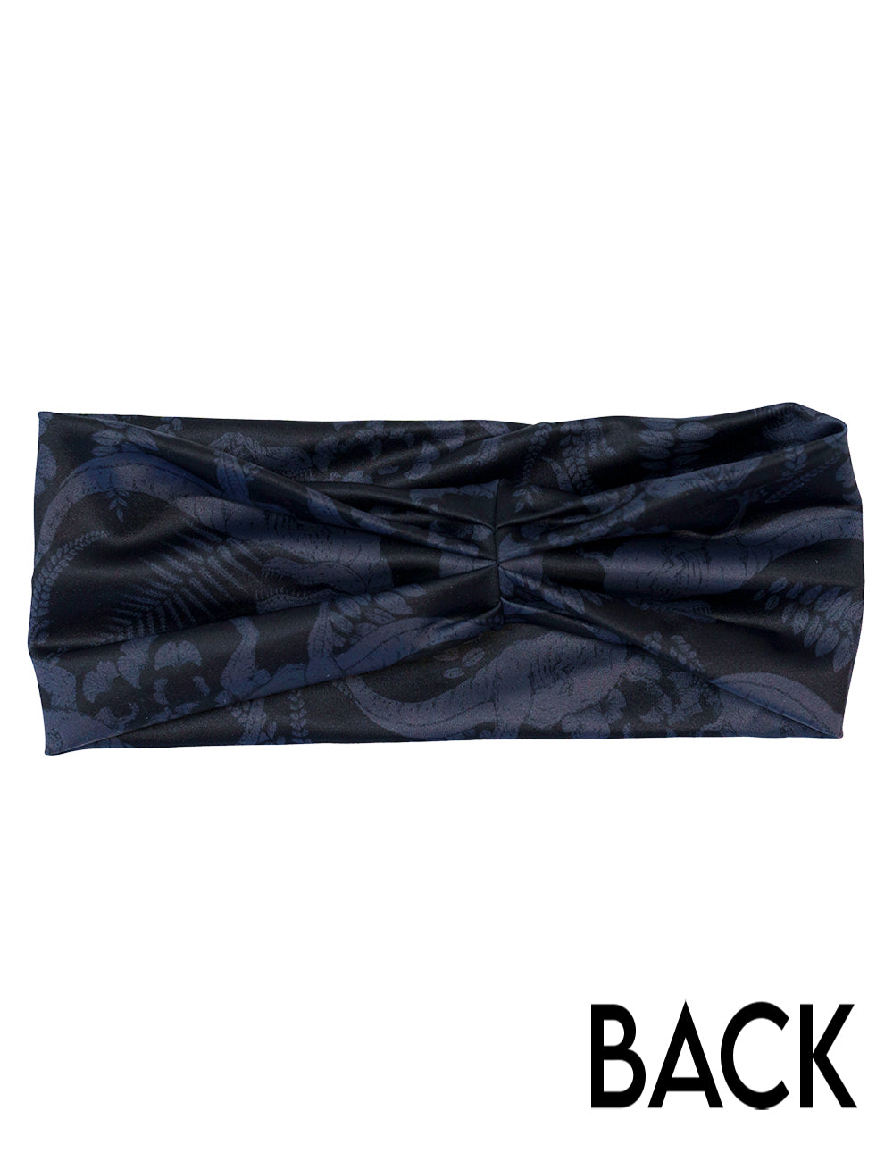 back of the black and grey dinosaur patterned headband against a white background