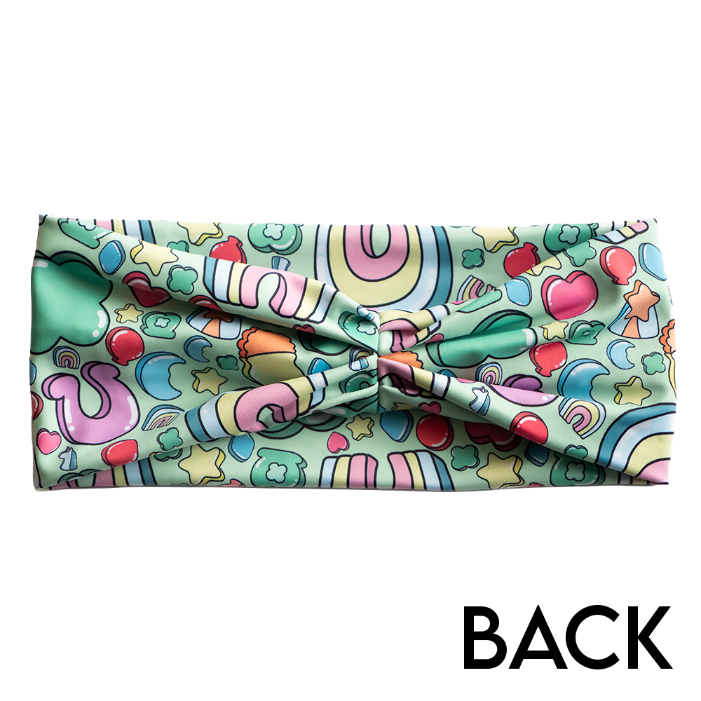 back of the headband with St Patrick's day inspired charms print against a white background