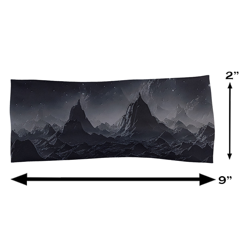 measurements for the black headband with a mountain and star pattern against a white background, measurements are 2 tall and 9 inches long