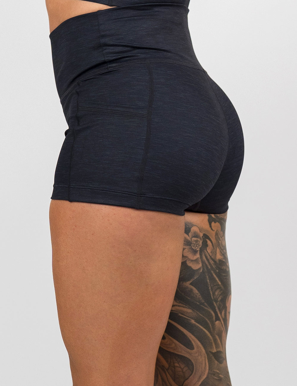 back of the 2.5 inch black heather pattern shorts against a white background