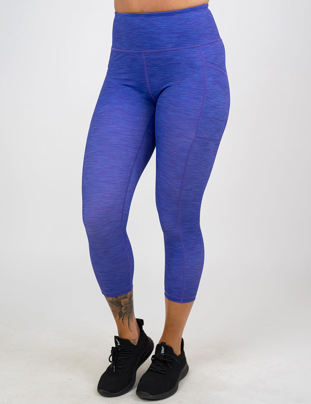 front of the capri purple heather pattern leggings against a white background