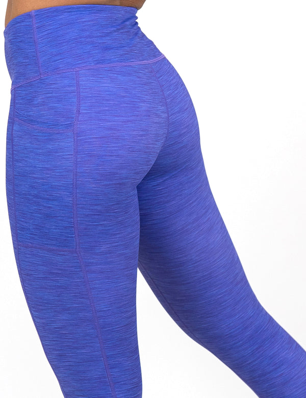 back of the purple heather pattern leggings against a white background