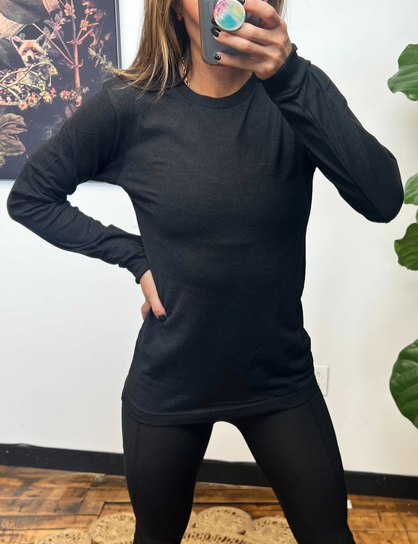 model wearing a black long sleeve shirt