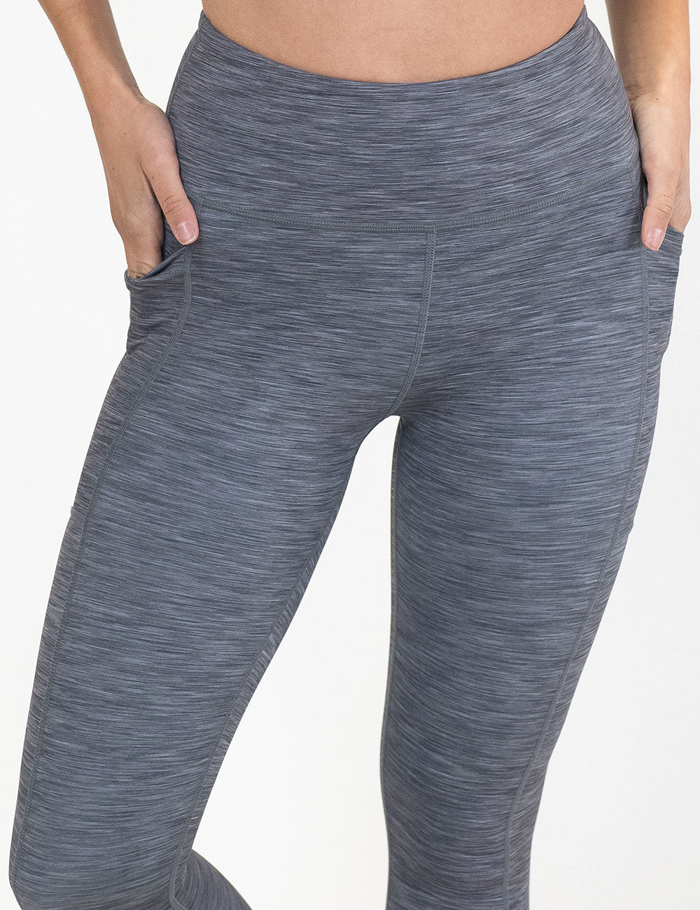 close up of the grey heather patterned leggings against a white background