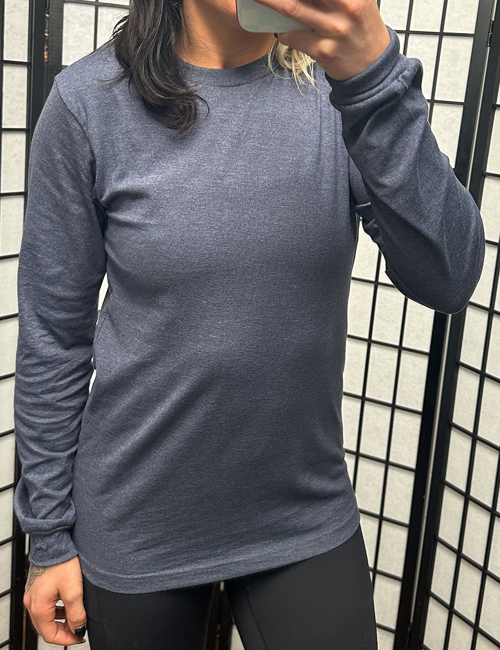model wearing the dark navy heather pattern l wearing the long sleeve shirt