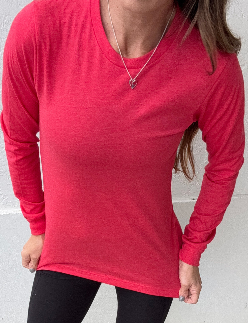 model wearing the red heather long sleeve tee