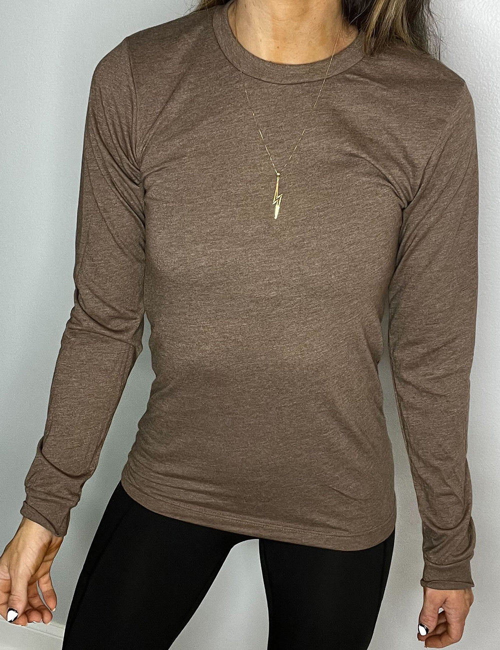 model wearing brown long sleeve shirt