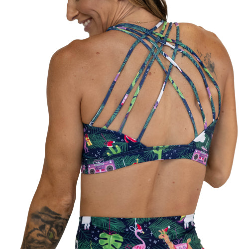 back view of model wearing sports bra with holiday ornaments on them