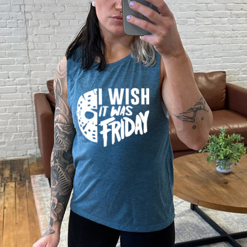 model wearing a teal colored tank top that has a quote saying "I Wish It Was Friday" in white