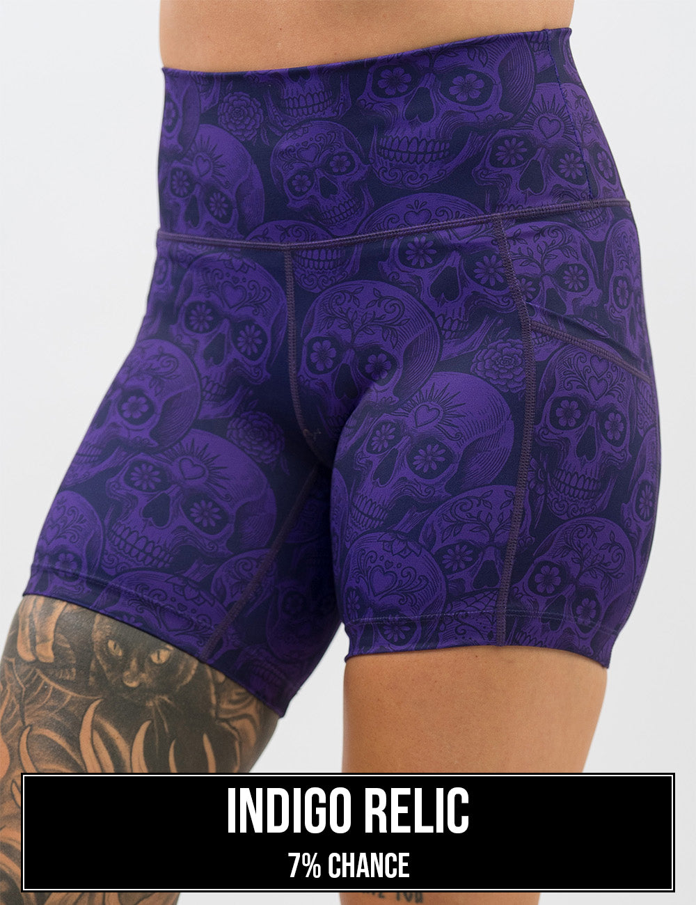 front of the purple calavera skulls against a dark purple background 5 inch shorts, the name of this print is indigo relic and it has a 7% chance of being unboxed