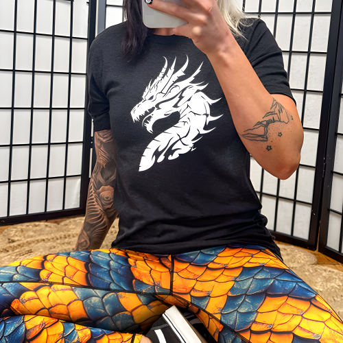 model wearing a black unisex shirt with a white dragon head graphic on it