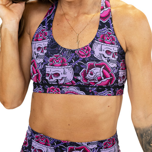front view of inked skull print sports bra
