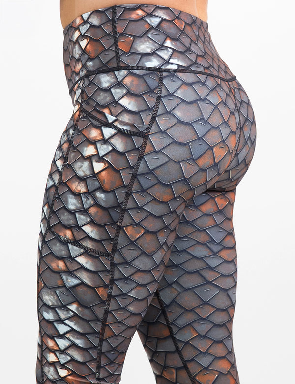side view of the iron sheet pattern leggings against a white background