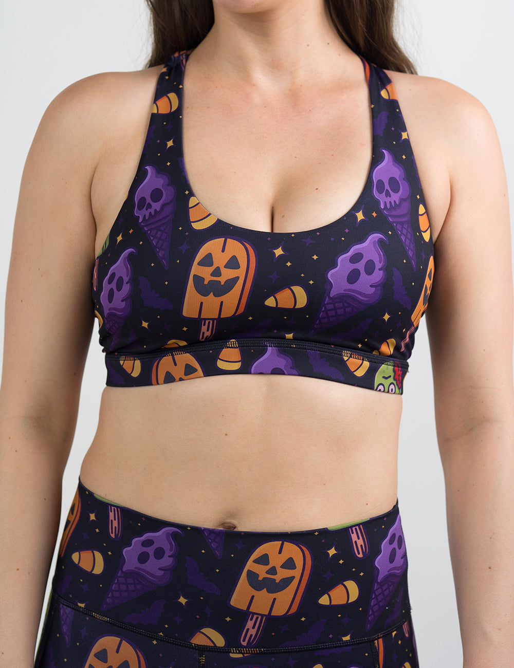 front of the zombie, jack o lantern, and ghost ice cream's sports bra against a white background
