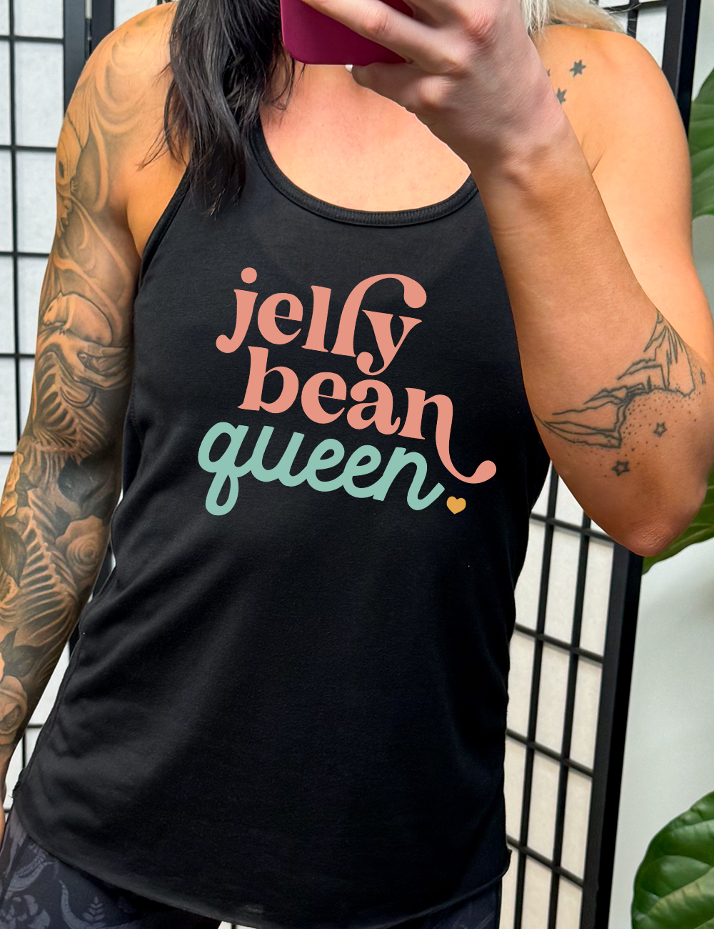 black racerback tank with the words "jelly bean queen" on it, punctuated with a little heart at the end