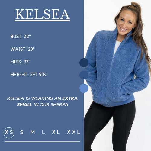 Model's measurements of 32 inch bust, 28 inch waist, 37 inch hips, and height of 5 foot 5 inches. She is wearing a size extra small in the sherpa