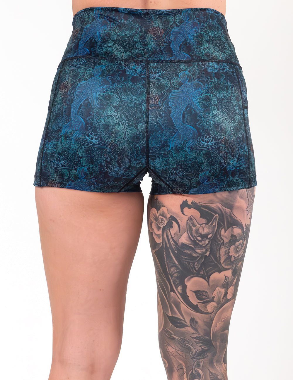 back of the 2.5 inch  stenciled koi pattern against a blue background shorts against a white background
