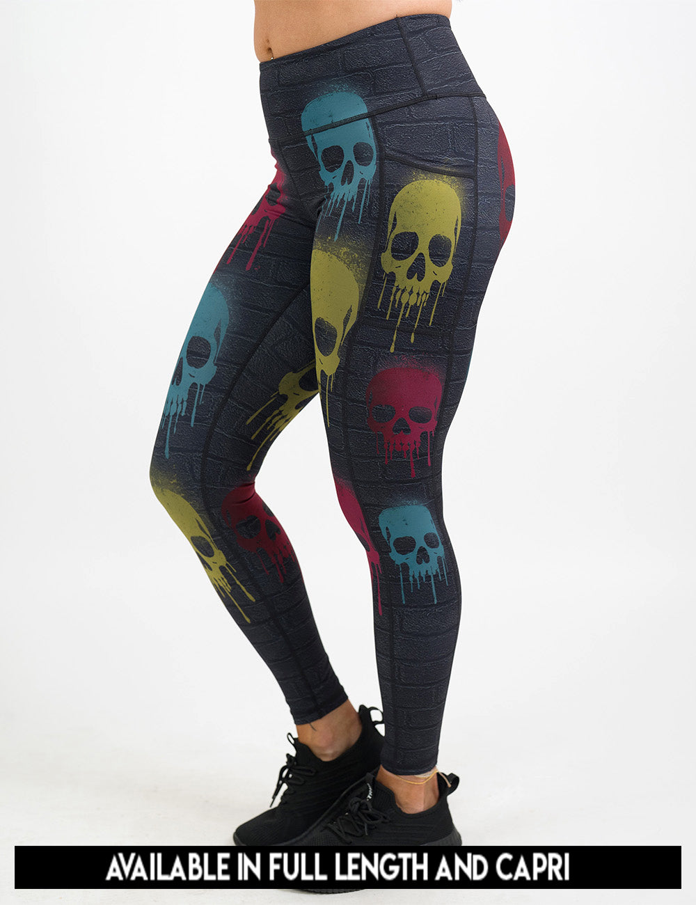 available lengths for the black brick leggings with spray painted red, yellow, and blue skulls all over, lengths include full length and capri