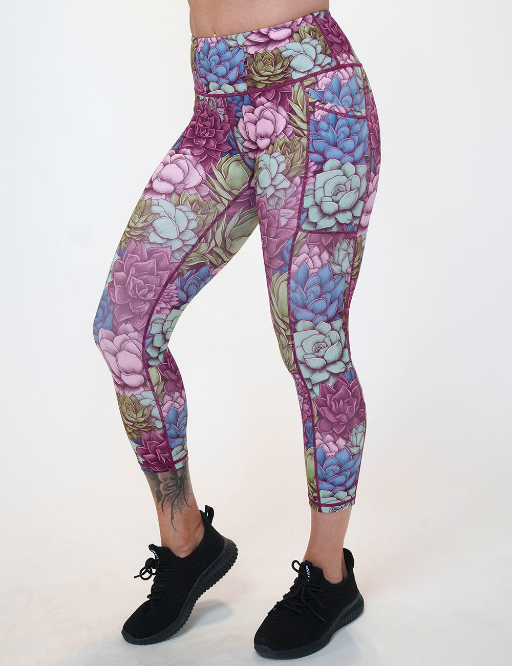 model wearing the capri succulent leggings facing the front against a white background