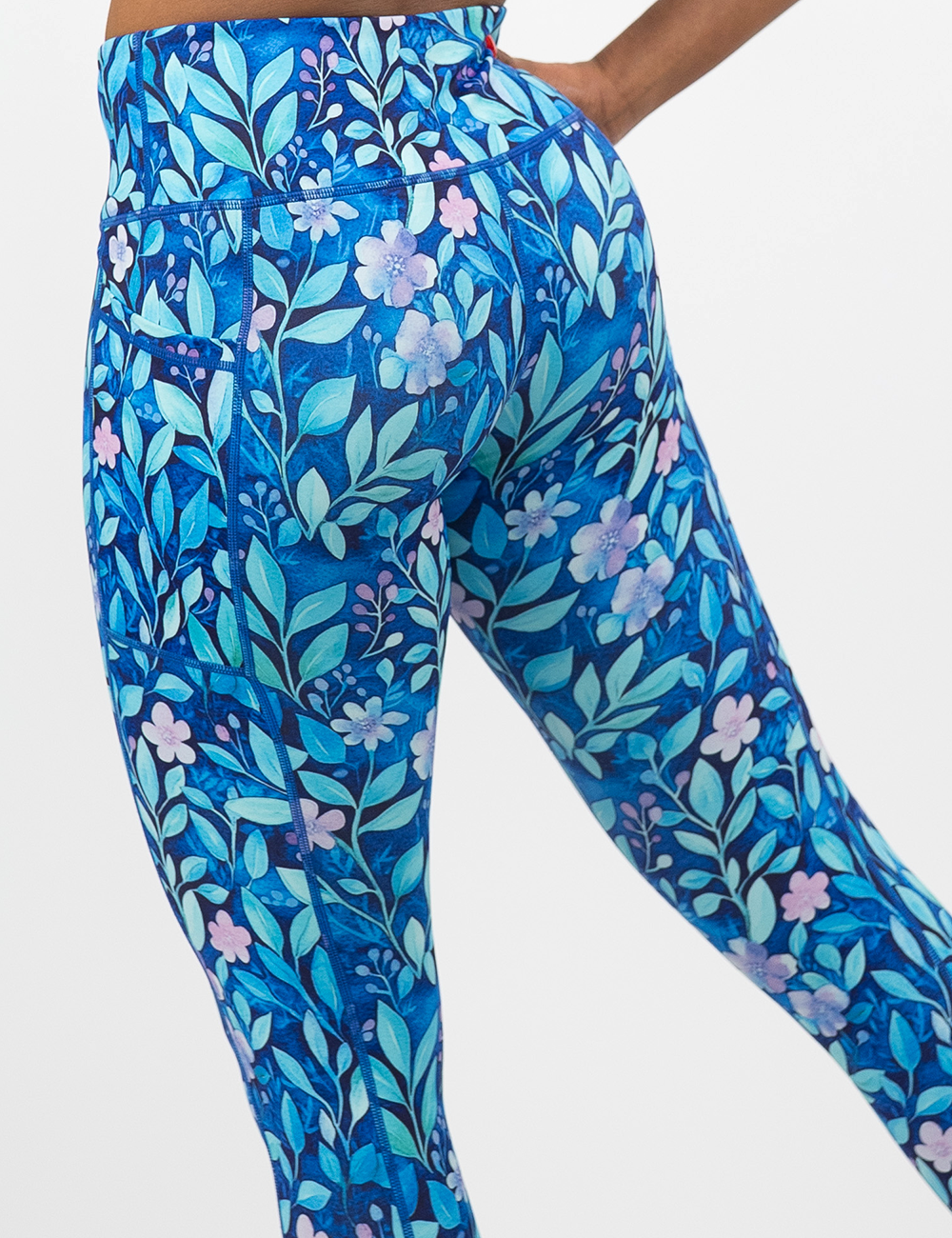 close up of the back of the blue flowers and vines leggings against a white background