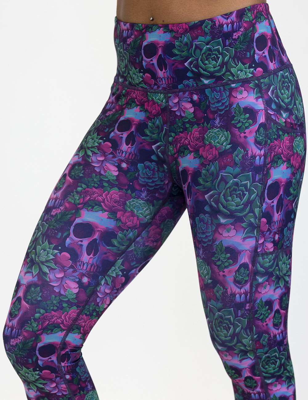 close up of the Floral and skull patterned leggings against a white background