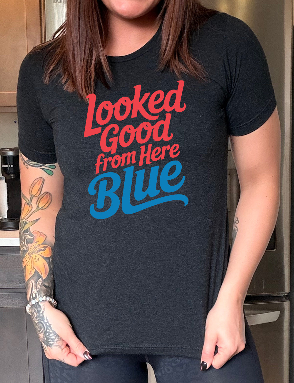 black unisex tee with the words "looked good from here blue" on it