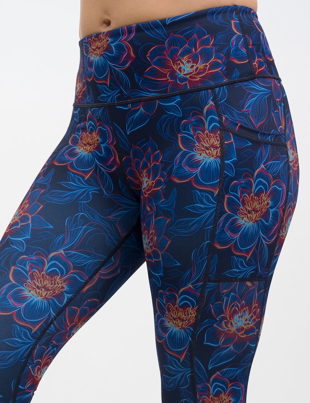 front of the neon flower leggings against a white background against a white background